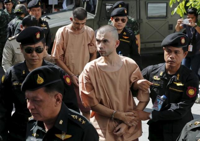 Suspects of the August 17 Bangkok blast, Bilal Mohammed (also known as Adem Karadag) and Yusufu Mieraili are escorted by soldiers and prison officers as they arrive at the military court in Bangkok, Thailand, in this November 24, 2015 file photo. REUTERS/Chaiwat Subprasom